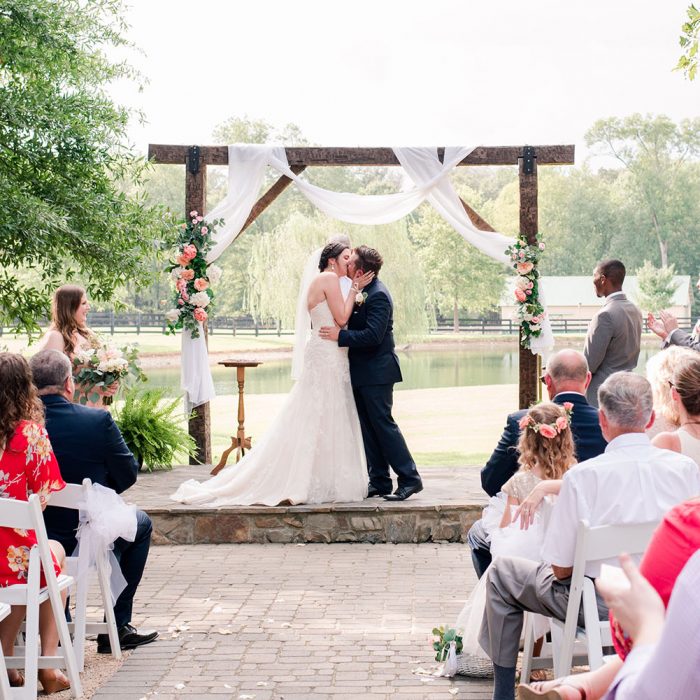 Bride and groom kissing during ceremony in Atlanta Georgia